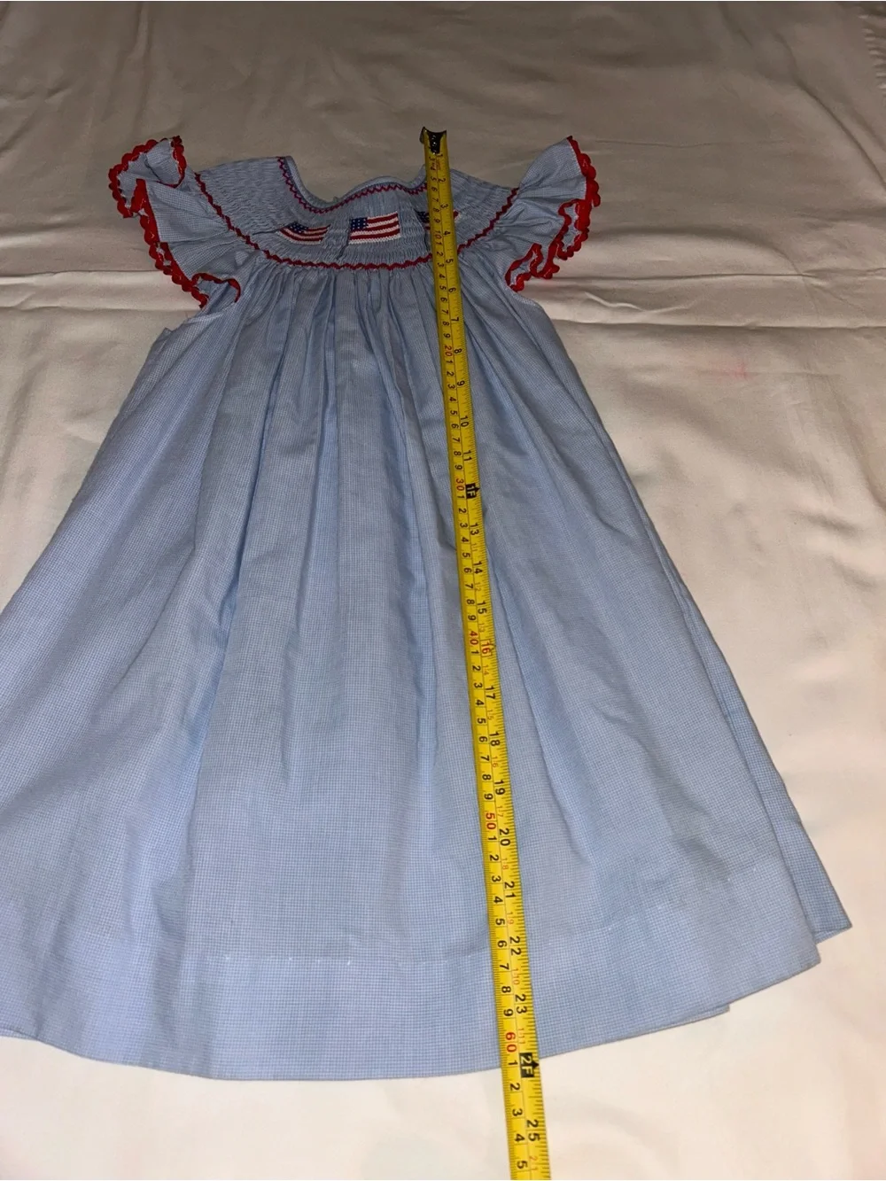 Girls' Light Blue Smocked Dress with Red Trim and Flag Embroidery